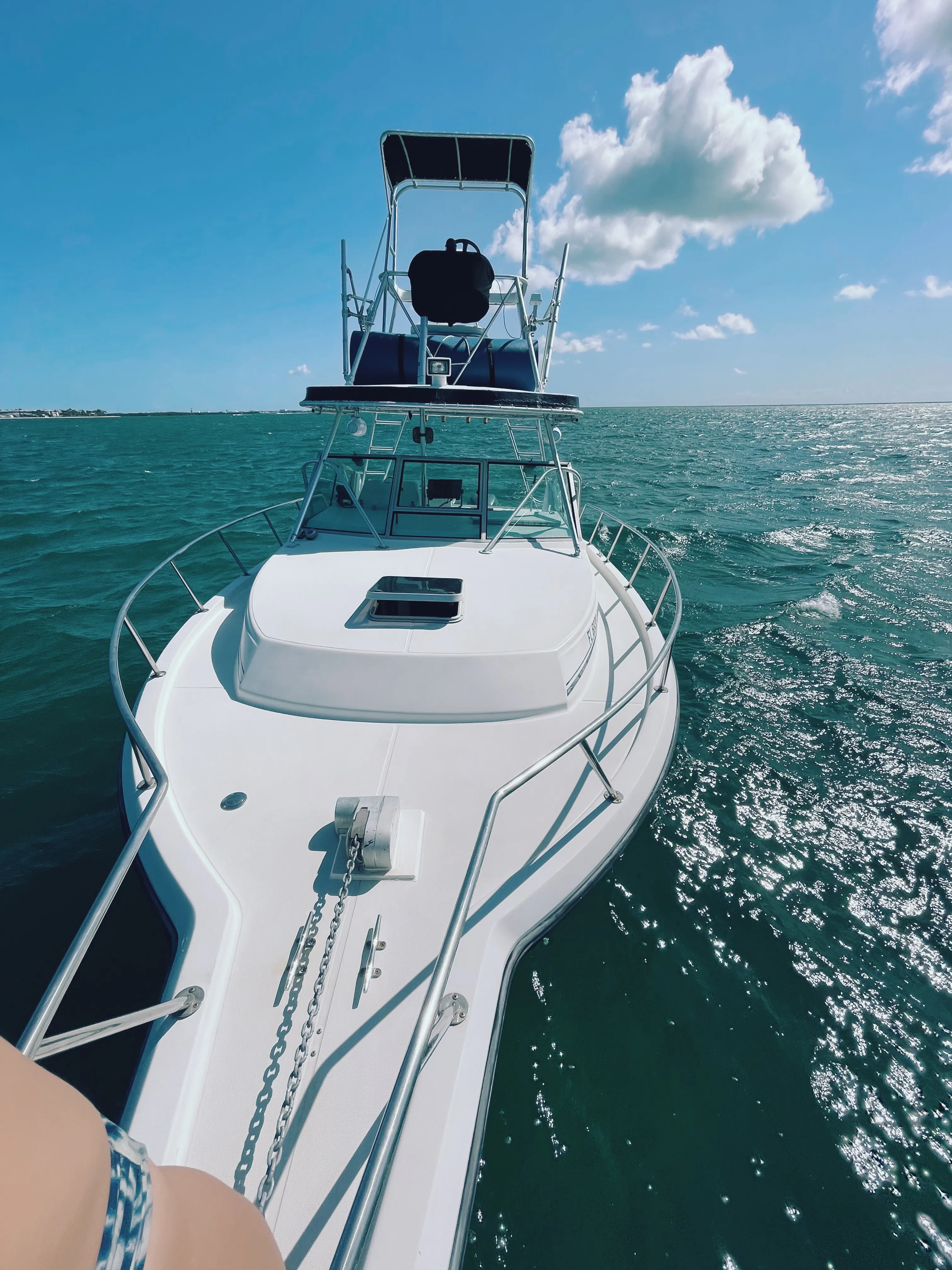Bow and observation tower of Captain Rio's 32 ft Stamas underway over green water near Key West
